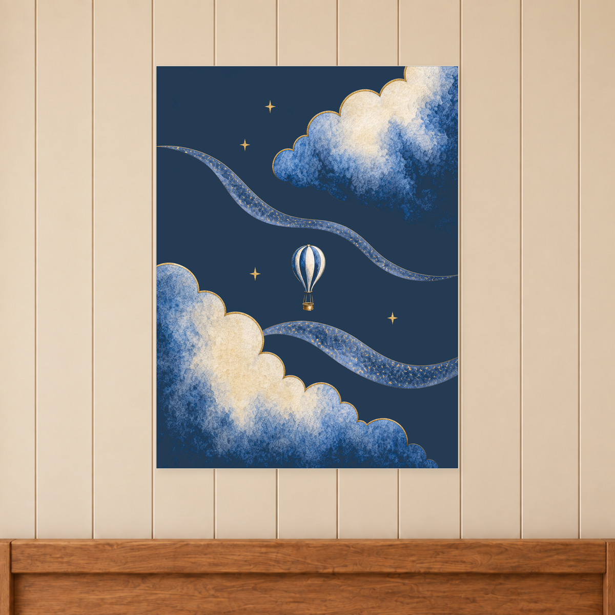 Moonrise Balloon and Clouds Print shown unframed above a timber bed headboard on a cream panelled wall.