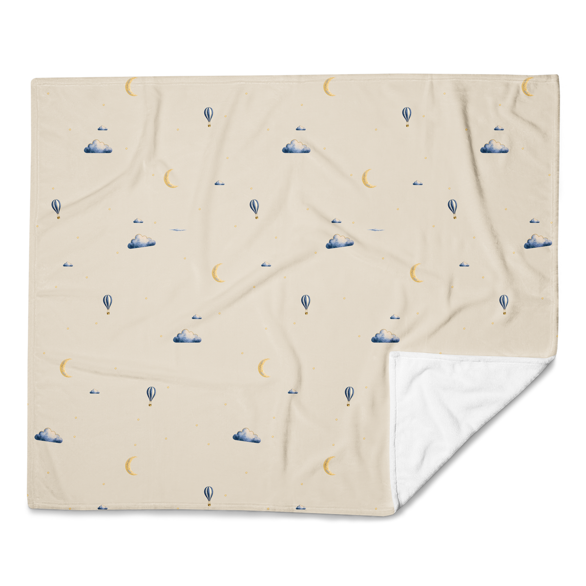 Printed Moonrise throw shown flat with a folded corner revealing its plain white reverse.