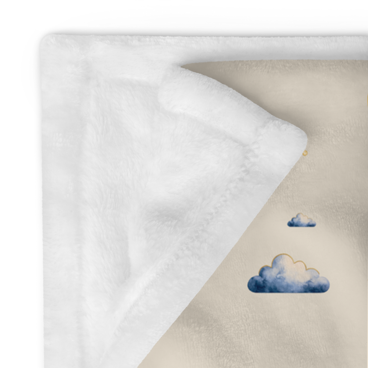 Close view of the plain white reverse and printed front edge of the Moonrise throw.