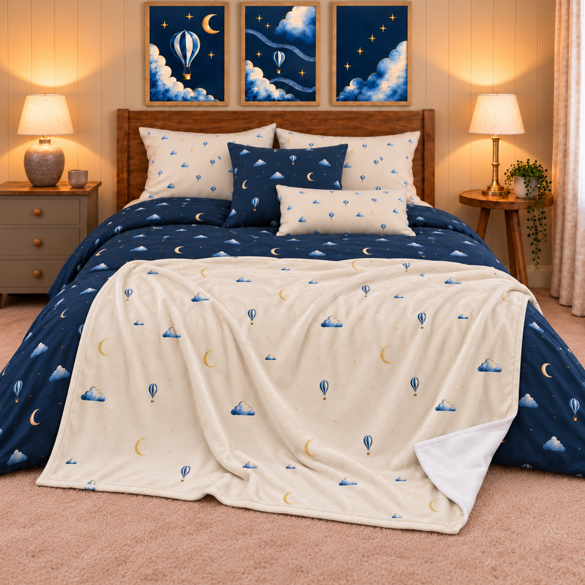 Moonrise silk-touch throw across the foot of the collection bed, with printed front and plain white reverse.