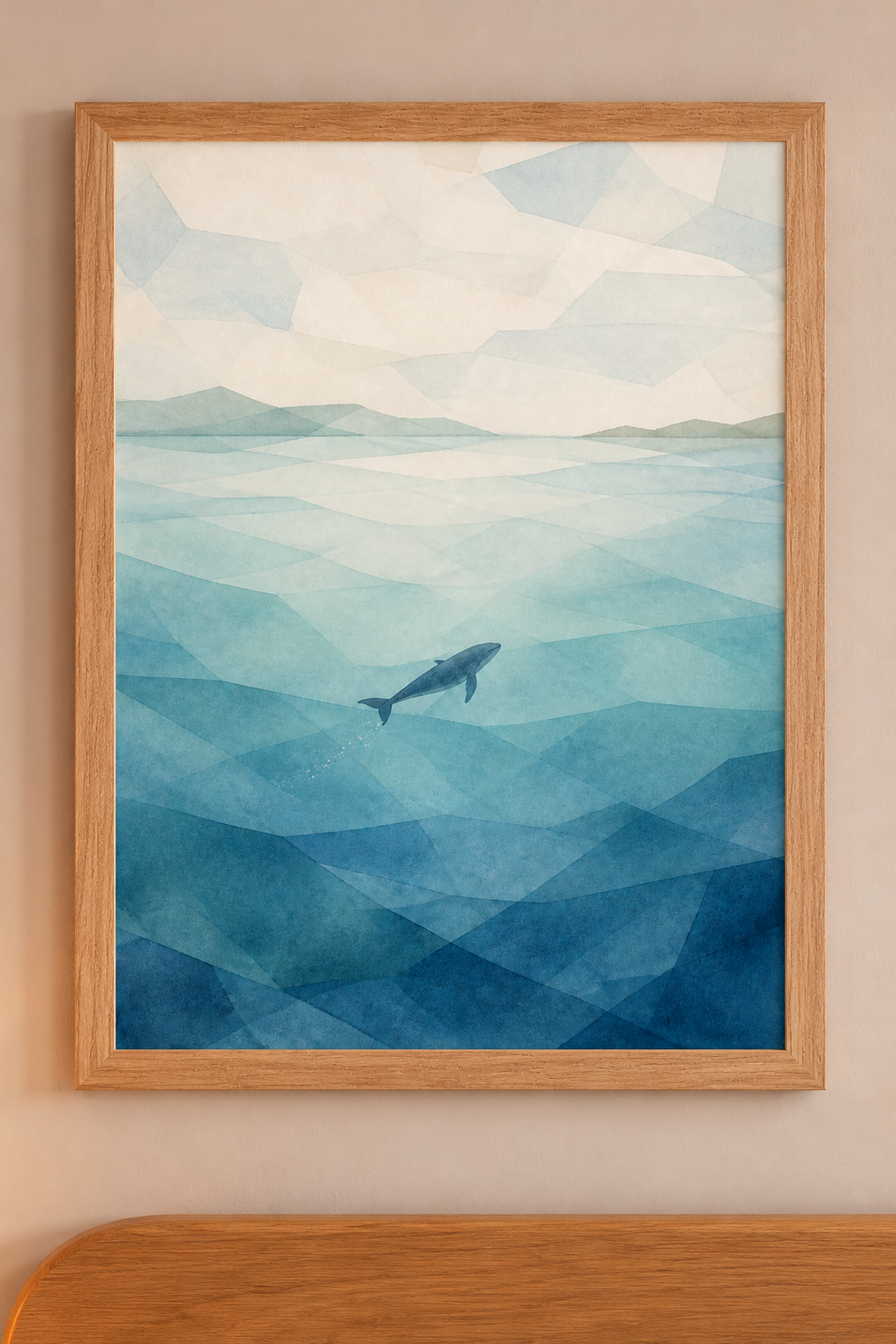 Seaglass Shore Whale in Blue Water print in a natural wood frame in the collection room.
