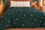 Mosswood Trail duvet cover in the existing room, with its green woodland print unobscured; coordinated ivory pillowcase shown separately.